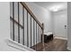 Inviting entryway features hardwood flooring, a bench with storage, and a view of the front door at 6352 Perry Creek Rd, Raleigh, NC 27616