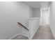 Hallway with carpeted floors and white wainscoting at 6352 Perry Creek Rd, Raleigh, NC 27616