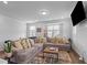 Cozy living room features a plush sectional sofa with decorative pillows and modern decor at 6352 Perry Creek Rd, Raleigh, NC 27616