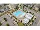 Aerial view of a community pool with a playground, lounge chairs, tables, and a gazebo at 6352 Perry Creek Rd, Raleigh, NC 27616
