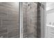 Modern walk-in shower with tiled walls and glass door at 6352 Perry Creek Rd, Raleigh, NC 27616