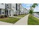 Street view of modern townhomes featuring well-kept lawns and sidewalks for community charm at 6352 Perry Creek Rd, Raleigh, NC 27616