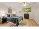 Cozy bedroom with wood floors, window view, ceiling fan and closet at 6412 Heartwood Dr, Chapel Hill, NC 27516