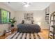 Cozy bedroom with modern décor, featuring large windows and natural light at 6412 Heartwood Dr, Chapel Hill, NC 27516