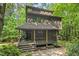 Stunning multi-story house featuring a cozy front porch and beautiful natural wood accents at 6412 Heartwood Dr, Chapel Hill, NC 27516