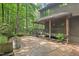 Welcoming front porch with lush landscaping and a concrete walkway leading to the house at 6412 Heartwood Dr, Chapel Hill, NC 27516