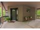 Cozy front porch features chairs, a small table and a welcome mat for guests at 6412 Heartwood Dr, Chapel Hill, NC 27516