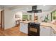 Open-concept kitchen with modern appliances and countertops, flowing into the living area at 6412 Heartwood Dr, Chapel Hill, NC 27516