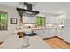 Modern kitchen featuring white cabinets, sleek countertops, and stainless steel appliances at 6412 Heartwood Dr, Chapel Hill, NC 27516