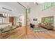 Open-concept living area with hardwood floors, kitchen and comfortable seating at 6412 Heartwood Dr, Chapel Hill, NC 27516