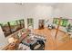 Spacious living room with vaulted ceiling and natural light showcasing modern furnishings at 6412 Heartwood Dr, Chapel Hill, NC 27516