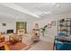 Bright living room features track lighting, stylish seating, and comfortable furnishings at 6412 Heartwood Dr, Chapel Hill, NC 27516