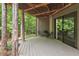 Covered patio area perfect for outdoor seating and enjoying the surrounding nature at 6412 Heartwood Dr, Chapel Hill, NC 27516