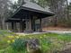 Community picnic shelter in wooded area featuring covered seating at 6412 Heartwood Dr, Chapel Hill, NC 27516