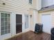 Wood back deck features multiple access doors to the home, grilling equipment at 6756 Olde Province Ct, Raleigh, NC 27609