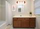Bathroom featuring a vanity, tub, shower, and tile flooring at 6756 Olde Province Ct, Raleigh, NC 27609