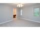 Bedroom with natural light, neutral carpet and access to the bathroom at 6756 Olde Province Ct, Raleigh, NC 27609