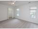 Spacious bedroom with two windows, a ceiling fan, and a large closet at 6756 Olde Province Ct, Raleigh, NC 27609