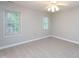 Empty bedroom featuring carpeting and natural light at 6756 Olde Province Ct, Raleigh, NC 27609