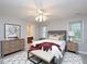 Bedroom featuring carpet, neutral walls, ceiling fan, and natural light at 6756 Olde Province Ct, Raleigh, NC 27609