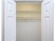 Standard walk-in closet with a single rod to hang clothes at 6756 Olde Province Ct, Raleigh, NC 27609