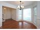 Open dining room with hardwood floors and chandelier at 6756 Olde Province Ct, Raleigh, NC 27609