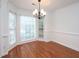 Bright dining room featuring hardwood floors and bay window at 6756 Olde Province Ct, Raleigh, NC 27609