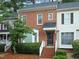 Charming brick townhome with well-maintained landscaping and inviting entrance at 6756 Olde Province Ct, Raleigh, NC 27609