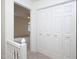 Hallway with carpeting and doors to the bedrooms at 6756 Olde Province Ct, Raleigh, NC 27609