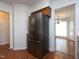 Kitchen with stainless steel refrigerator and oak cabinets and white backsplash at 6756 Olde Province Ct, Raleigh, NC 27609