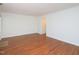Bright living room with hardwood floors and white trim at 6756 Olde Province Ct, Raleigh, NC 27609