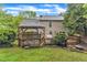 Home's backyard with a deck and gazebo, offering a delightful outdoor space for leisure and entertainment at 6828 Edwell Ct, Raleigh, NC 27617