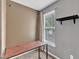Bedroom with large window offers natural light and highlights the desk area, creating a functional and inviting space at 6828 Edwell Ct, Raleigh, NC 27617