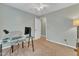 This bedroom features neutral walls and carpeting, a glass desk, and a ceiling fan at 6828 Edwell Ct, Raleigh, NC 27617