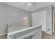 The bedroom features light-colored walls, carpeted floors, a ceiling fan and a closet at 6828 Edwell Ct, Raleigh, NC 27617