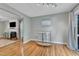 Open dining area with hardwood floors, adjacent to the living room, providing a seamless flow at 6828 Edwell Ct, Raleigh, NC 27617