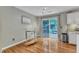 The dining room boasts hardwood floors and sliding doors to the outdoor deck at 6828 Edwell Ct, Raleigh, NC 27617