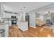 Open-concept kitchen with stainless steel appliances, a butcher block island, and easy access to living areas at 6828 Edwell Ct, Raleigh, NC 27617