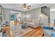 Spacious living room features hardwood floors, a stylish area rug, and an open layout with comfortable seating at 6828 Edwell Ct, Raleigh, NC 27617