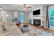 Bright living room features a fireplace, hardwood floors, and a neutral color scheme at 6828 Edwell Ct, Raleigh, NC 27617