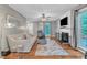 Cozy living room with hardwood floors, fireplace, and modern furniture; perfect for relaxing and entertaining at 6828 Edwell Ct, Raleigh, NC 27617
