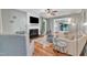 Inviting living room features hardwood floors, a cozy fireplace, and an open layout with comfortable seating at 6828 Edwell Ct, Raleigh, NC 27617