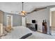 Main bedroom with vaulted ceiling, fan, large windows and ensuite bathroom at 6828 Edwell Ct, Raleigh, NC 27617