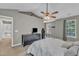 Spacious main bedroom provides natural light from windows and showcases modern decor at 6828 Edwell Ct, Raleigh, NC 27617