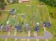 Expansive aerial view of neighborhood homes, featuring a large backyard and in-ground pool at 71 Sandy Farm Ct, Willow Springs, NC 27592