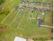 Aerial view of homes, offering large lots, in-ground pools, and garden areas at 71 Sandy Farm Ct, Willow Springs, NC 27592