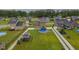 Wide aerial view of the property featuring a large backyard, pool, and white picket fence at 71 Sandy Farm Ct, Willow Springs, NC 27592