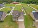 Aerial view of the property highlighting its well-maintained lawn and a spacious, fenced backyard at 71 Sandy Farm Ct, Willow Springs, NC 27592