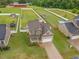 Aerial view showcasing the home's roof, driveway, and large, fully fenced backyard at 71 Sandy Farm Ct, Willow Springs, NC 27592