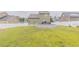 Expansive backyard featuring an above-ground pool surrounded by a white picket fence at 71 Sandy Farm Ct, Willow Springs, NC 27592